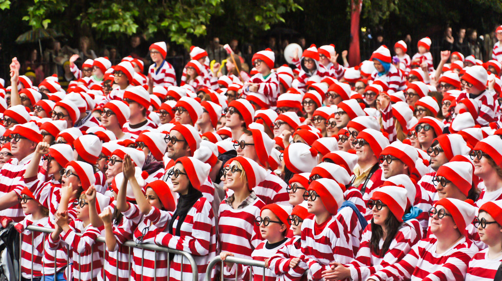 crowd of people in identical "where's waldo?" costumes