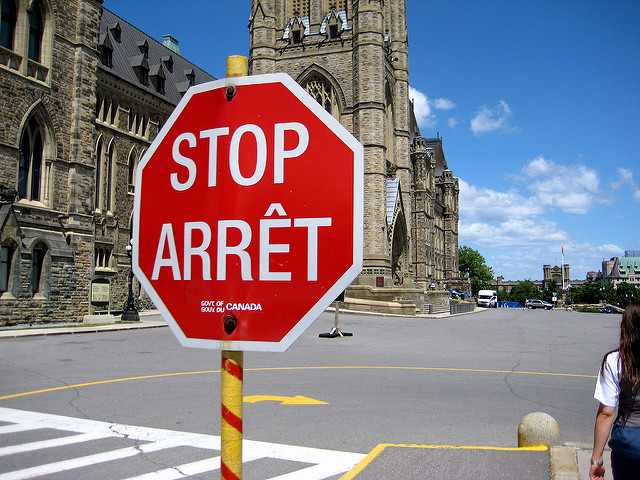 Canadian stop sign reads "stop" and "arret"