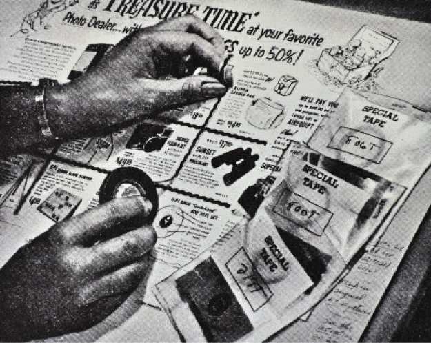 vintage photo of newspaper layout artist at work
