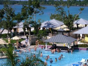 A swimming pool full of people at a resort