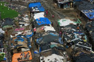 Dilapidated slum dwellings are shown from above